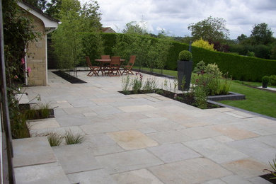 This is an example of a contemporary patio in Dorset.