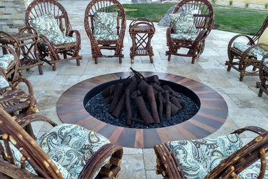Example of a large trendy backyard concrete paver patio design in Denver with a fire pit and no cover