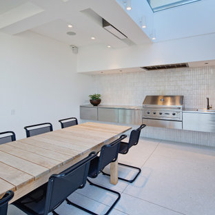 Design ideas for a modern patio in Sydney with a roof extension.