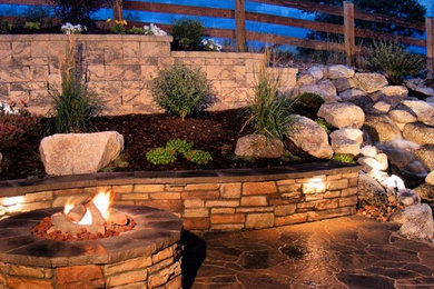Mid-sized elegant backyard stone patio photo in San Francisco with a fire pit and no cover