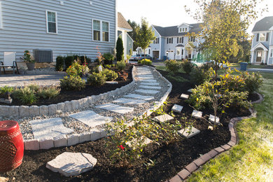 Example of a small zen backyard concrete paver patio design in Philadelphia with no cover