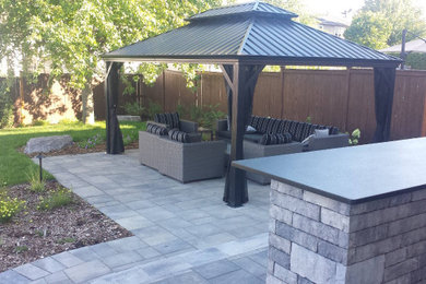 Patio - modern patio idea in Ottawa