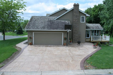 This is an example of a large patio in Minneapolis with stamped concrete.