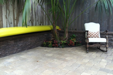 Example of a mid-sized island style patio design in Orange County
