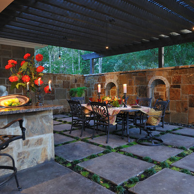 Inspiration for a large timeless side yard concrete paver patio remodel in Houston with a pergola