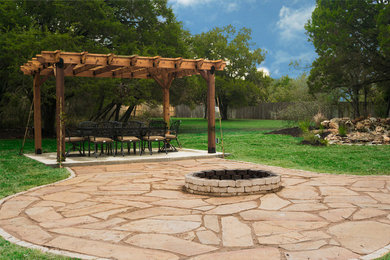 Example of a backyard concrete patio design in Austin with a pergola