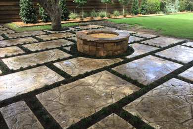 Inspiration for a huge eclectic backyard patio remodel in Dallas with a fire pit