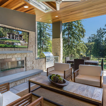 Enjoy the Great Outdoors On This Stone Deck For Entertaining