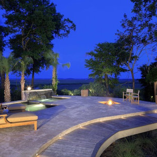 Patio - large contemporary backyard stone patio idea in Atlanta with a fire pit and no cover