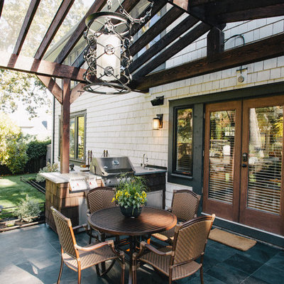 Patio - traditional patio idea in Vancouver with a pergola