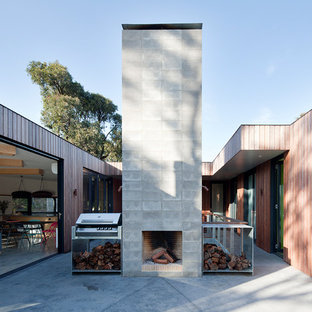 Scandinavian courtyard patio in Geelong with with fireplace, concrete slab and no cover.