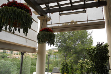 Inspiration for a large timeless side yard patio remodel in Orange County with a pergola