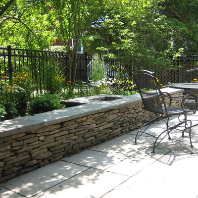 Patio - contemporary backyard stone patio idea in Boston