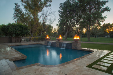 Mid-sized tuscan backyard tile pool photo in Phoenix