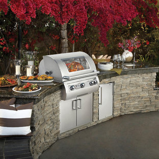 Patio kitchen - mid-sized transitional backyard concrete patio kitchen idea in Los Angeles with no cover
