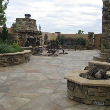 Fire pit in enclosed courtyard with wood burning fireplace