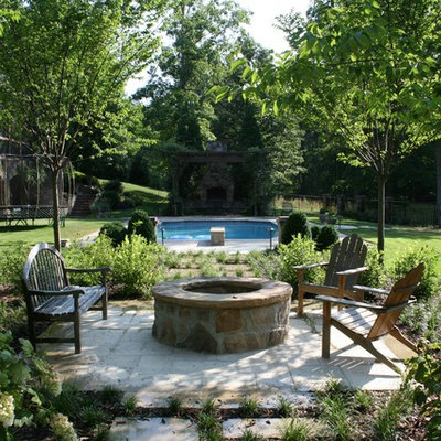 Elegant patio photo in Birmingham with a fire pit