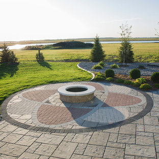 Patio - mid-sized craftsman backyard brick patio idea with a fire pit