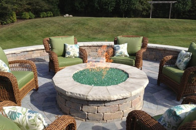Patio - mid-sized traditional backyard concrete paver patio idea in Chicago with a fire pit