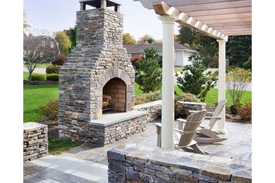 Inspiration for a large mediterranean back patio in Providence with a fire feature.