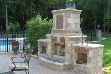 Patio - transitional backyard brick patio idea in Cleveland with no cover and a fire pit