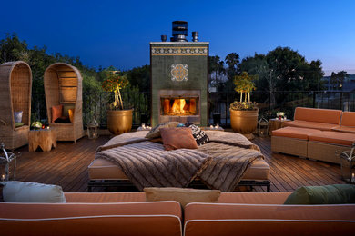 Photo of a large back patio in Phoenix with a fire feature and decking.