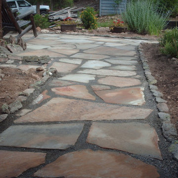 Flagstone patio Kittredge, CO. By Mountaineer Landscaping and Painting LLC.
