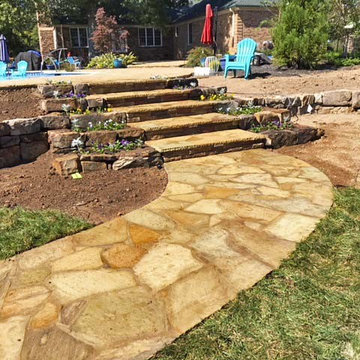 Flagstone walkway to flagstone steps and pool patio before the landscaping was i