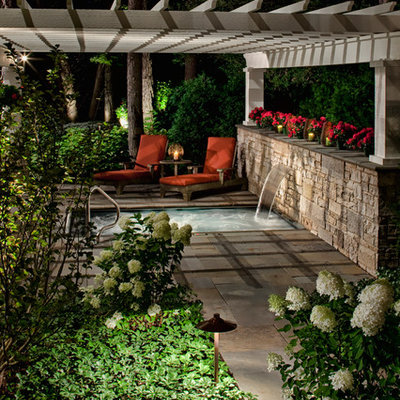 Example of a classic patio fountain design in Chicago with a pergola