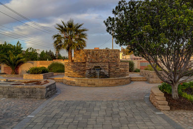 Inspiration for a craftsman courtyard brick patio fountain remodel in San Luis Obispo
