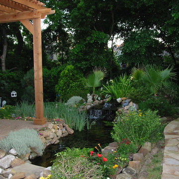 Fountain with Landscaping & Arbor, stone pathway.