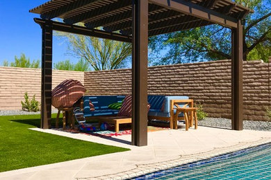 Inspiration for a contemporary backyard patio remodel in Phoenix with a pergola