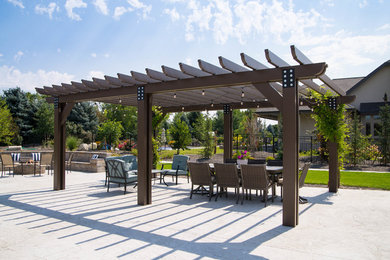 Photo of a classic back patio in Boise with a pergola.