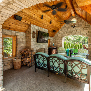 Example of a french country patio design in Detroit