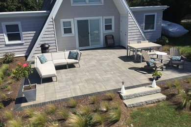 Inspiration for a medium sized beach style back patio in Providence with concrete paving.