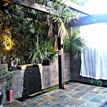 Front entry Asian patio with koi pond