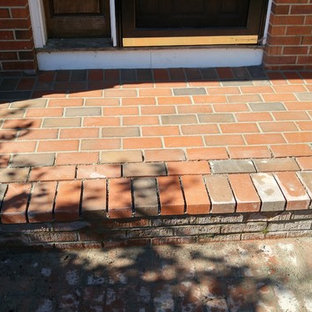 Esempio di un patio o portico vittoriano