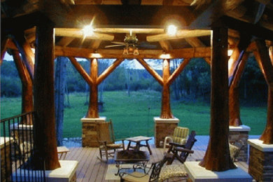 Patio - traditional backyard patio idea in Other with a roof extension