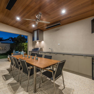 This is an example of a contemporary patio in Perth with an outdoor kitchen and a roof extension.