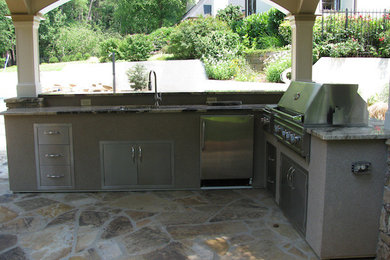 Example of a large backyard patio kitchen design in Atlanta with a gazebo