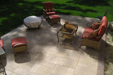 Patio - mid-sized backyard stamped concrete patio idea in Boston with no cover