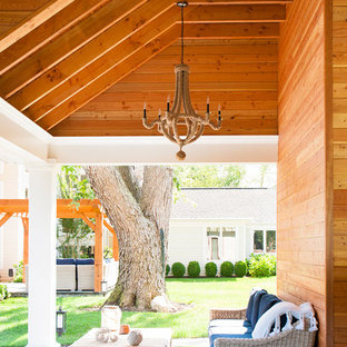 Patio kitchen - small coastal backyard stone patio kitchen idea in Other with a roof extension