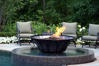Inspiration for a large transitional backyard concrete paver patio remodel in Boston with a fire pit and no cover