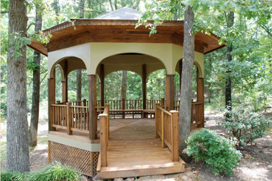 Inspiration for a gravel patio remodel in Little Rock with a gazebo