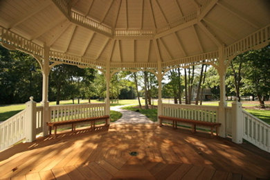 Photo of a large classic back patio in New York with a gazebo.