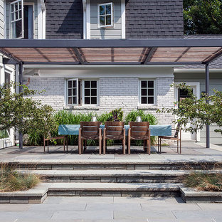 Inspiration for a contemporary patio remodel in Chicago with a pergola