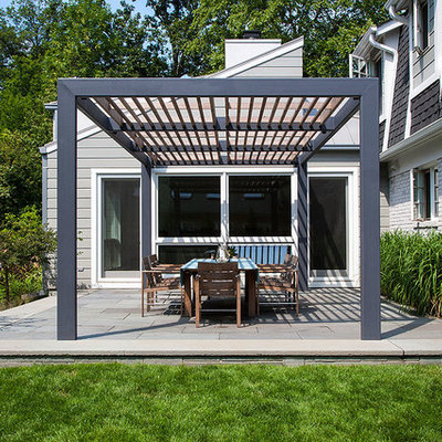 Inspiration for a contemporary patio remodel in Chicago with a pergola
