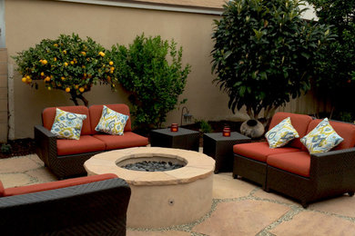 Patio - mid-sized transitional backyard stone patio idea in Los Angeles with a fire pit and no cover