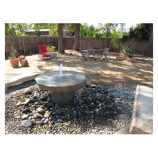 Granite Millstone Water Feature and Seating Area on Decomposed Granite ...