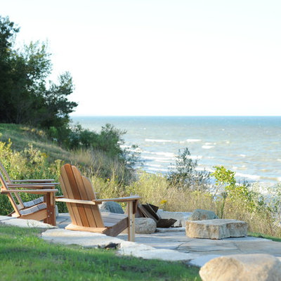 Elegant patio photo in Grand Rapids with a fire pit